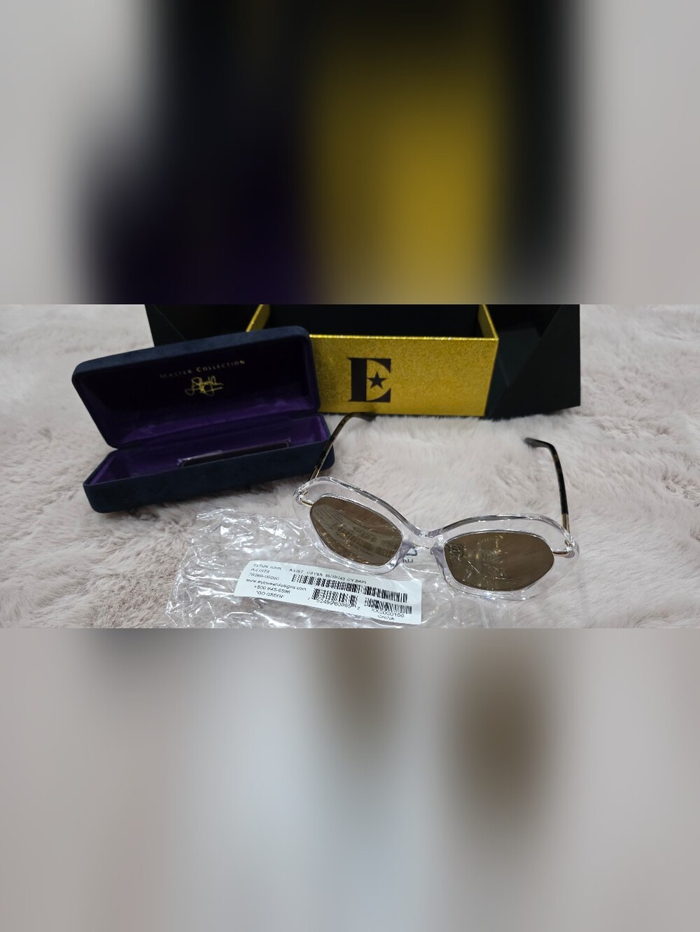 Elton John 'Crybr' Clear Frame Sunglasses with Brown Lenses